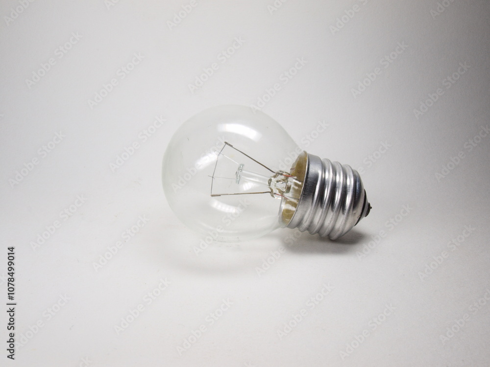 The photo shows an incandescent light bulb. Lighting The photo shows an incandescent light bulb. Lighting