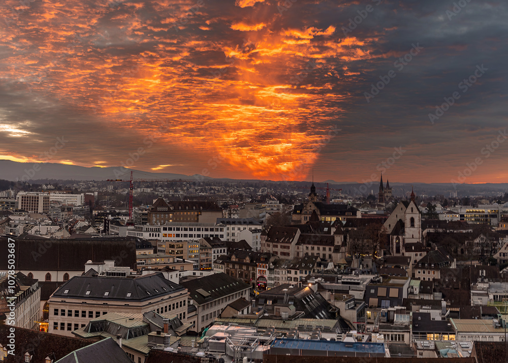 Obraz premium The Swiss big city Basel under the beautiful sunset clouds in winter
