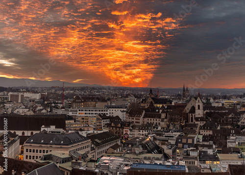 The Swiss big city Basel under the beautiful sunset clouds in winter