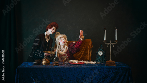 Canvas Print Regal empress, dressed in luxurious 18th-century attire, with smartphone taking selfie with her favorite against dark vintage background