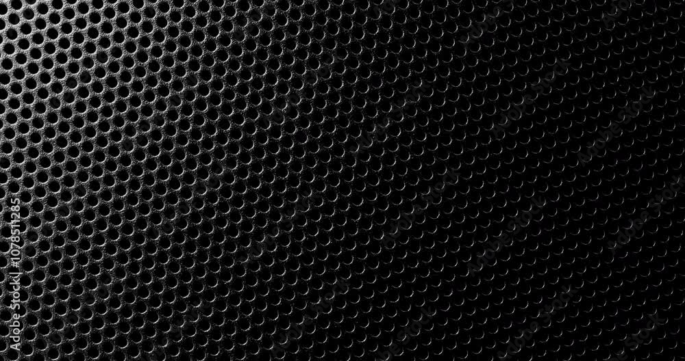 Black perforated surface texture. Close-up view of a black perforated surface with a repeating hole pattern, creating a textured and industrial look. Black perforated surface texture. Close-up view of a black perforated surface with a repeating hole pattern, creating a textured and industrial look.