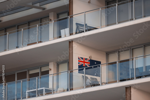 Australian flag displayed on wall of balcony on high rise apartment photo