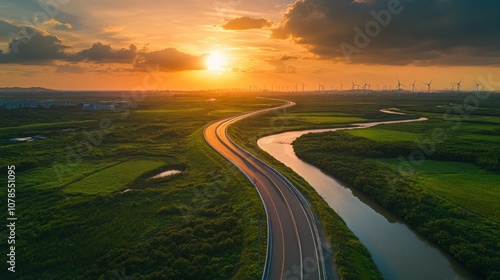 Aerial View of a Winding Road and River at Sunset