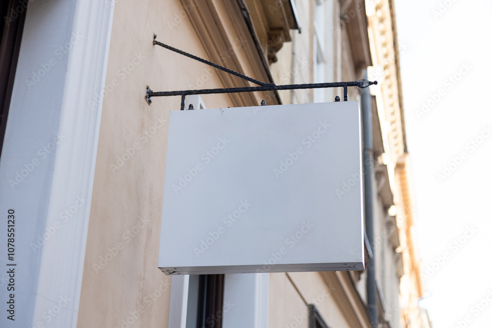 Street storefront shop, cafe, restaurant mounted signboard mock up design template. Blank white store sign design mockup.
