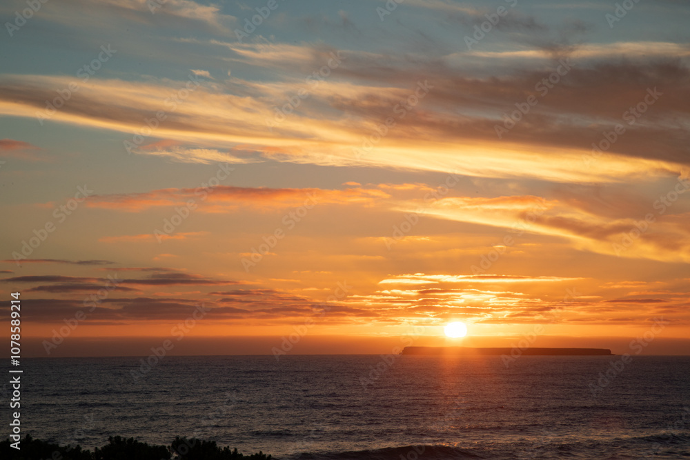 Sun setting behind Lady Julia Percy Island viewed across the water from The Crags on The Great Ocean Sun setting behind Lady Julia Percy Island viewed across the water from The Crags on The Great Ocean
