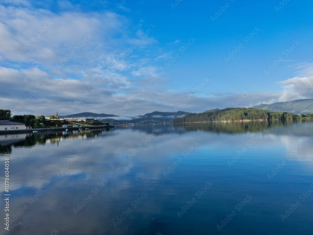 Fototapeta premium Serene Lake Landscape with Reflections