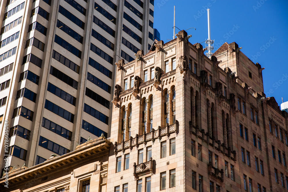 old sandstone building next to an office building in Brisbane