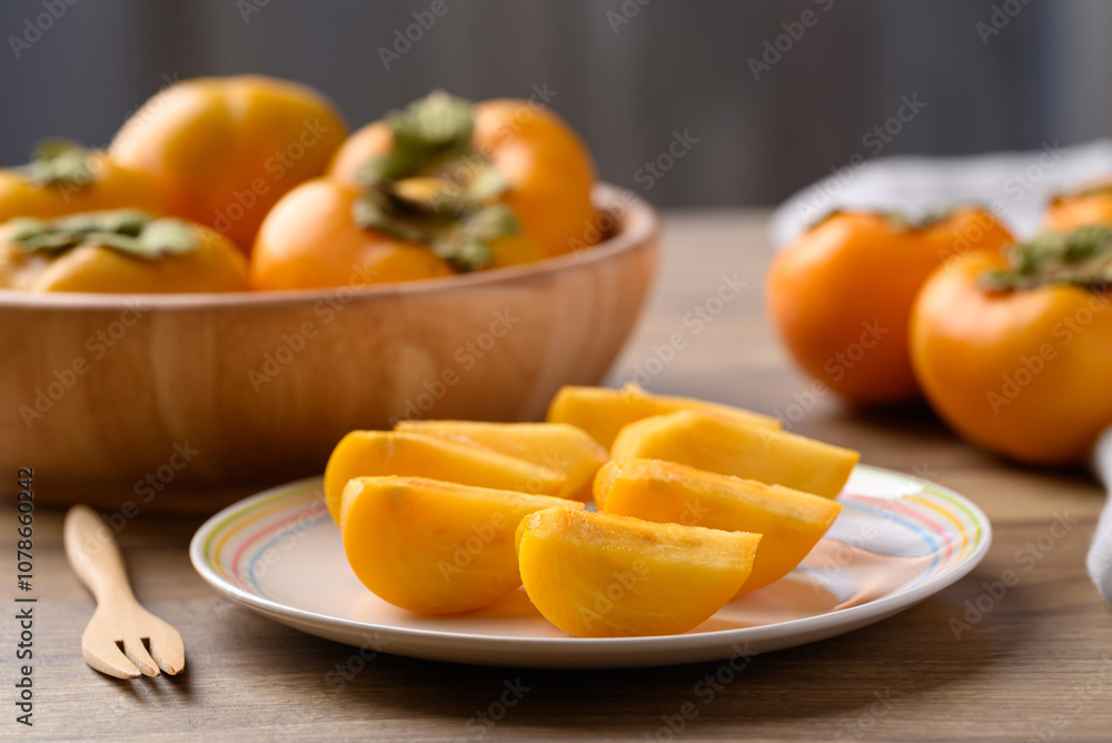 Sliced ripe persimmon ready to eating, Autumn fruit Sliced ripe persimmon ready to eating, Autumn fruit