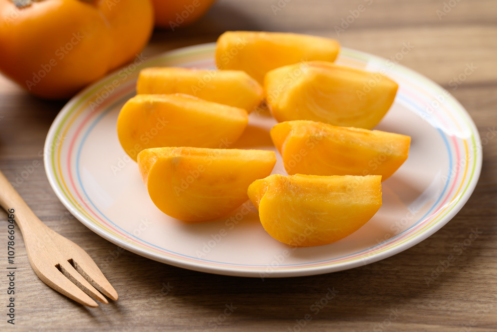 Sliced ripe persimmon ready to eating, Autumn fruit Sliced ripe persimmon ready to eating, Autumn fruit
