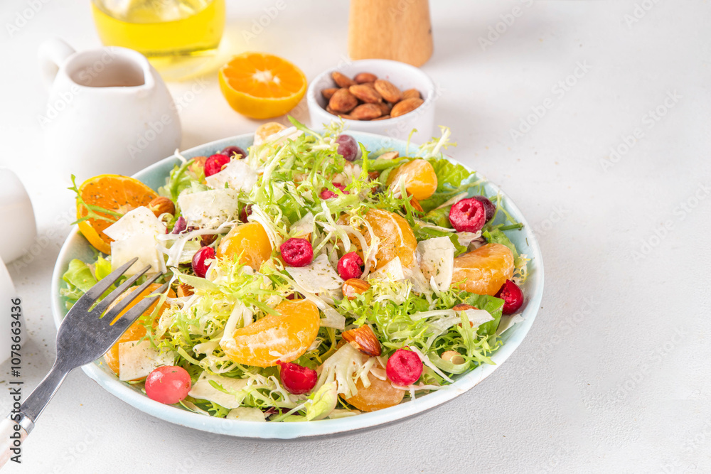 Salad bowl with lettuce, tangerines, nuts and cranberry Salad bowl with lettuce, tangerines, nuts and cranberry