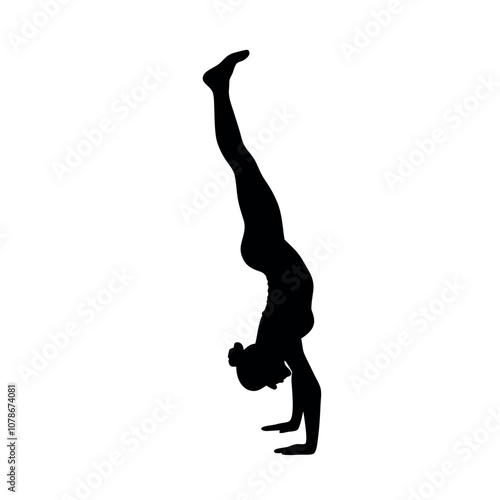 A woman doing a handstand. She is wearing a black outfit. The image is black and white