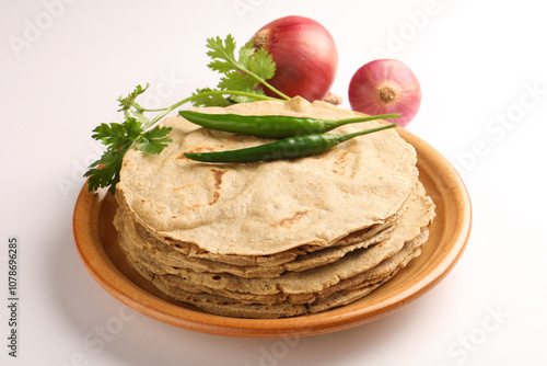 Jowar Roti or Jowar Bhakri is a staple in the Indian states of Maharashtra, Gujarat, and Karnataka. Sorghum is a versatile and nutrient-rich grain In Maharashtra  photo