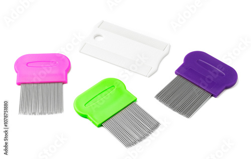 Colorful plastic and metal combs on a white background photo