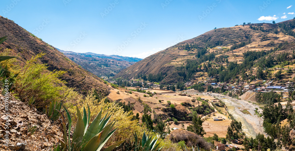 Village on the Banks of a River that Passes near the Black and White Mountain Range in Huaraz, Peru
