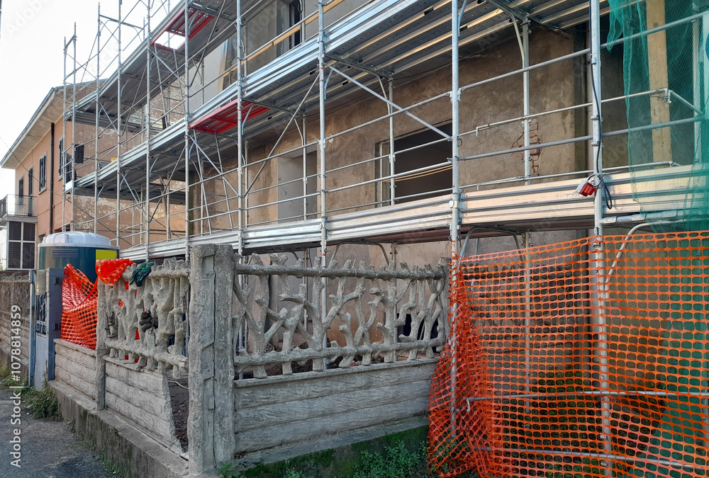 Fototapeta premium Lavori in corso nel cantiere edile - costruire