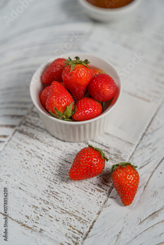 morning breakfast, juicy berries in a light plate, cherries, strawberries, raspberries