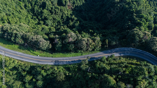 Road number three, Nan Province, aerial view of a beautiful road through the mountains full of green trees. Travel concept, transportation concept.