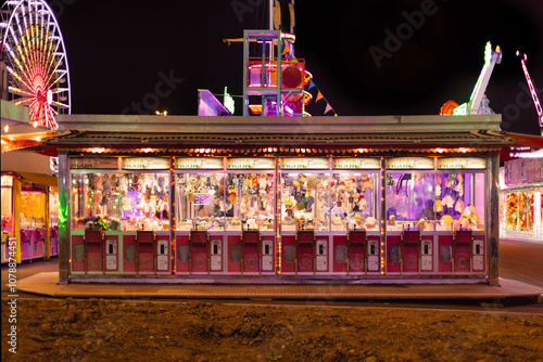 A Vibrant Nighttime Carnival Game Booth, filled with Colorful Prizes and Joyful Memories