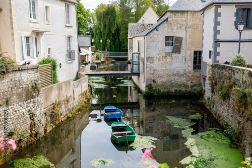 The water mill on the River Aure in the medieval town of Bayeux on the Normandy Coast of France. photo