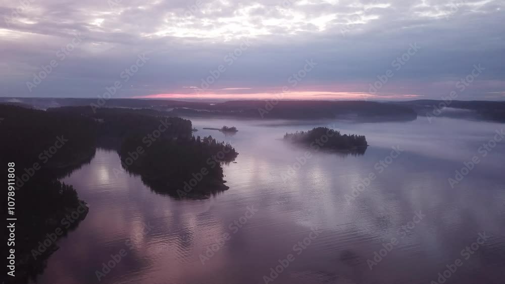 Long static dark aerial view on the evening lake with moving fog and clouds Long static dark aerial view on the evening lake with moving fog and clouds