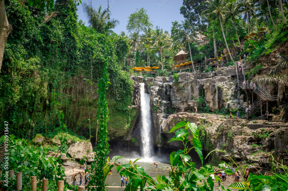Beautiful Tegenungan waterfall in tropical rainforest in Bali, Indonesia