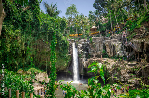 Beautiful Tegenungan waterfall in tropical rainforest in Bali, Indonesia photo