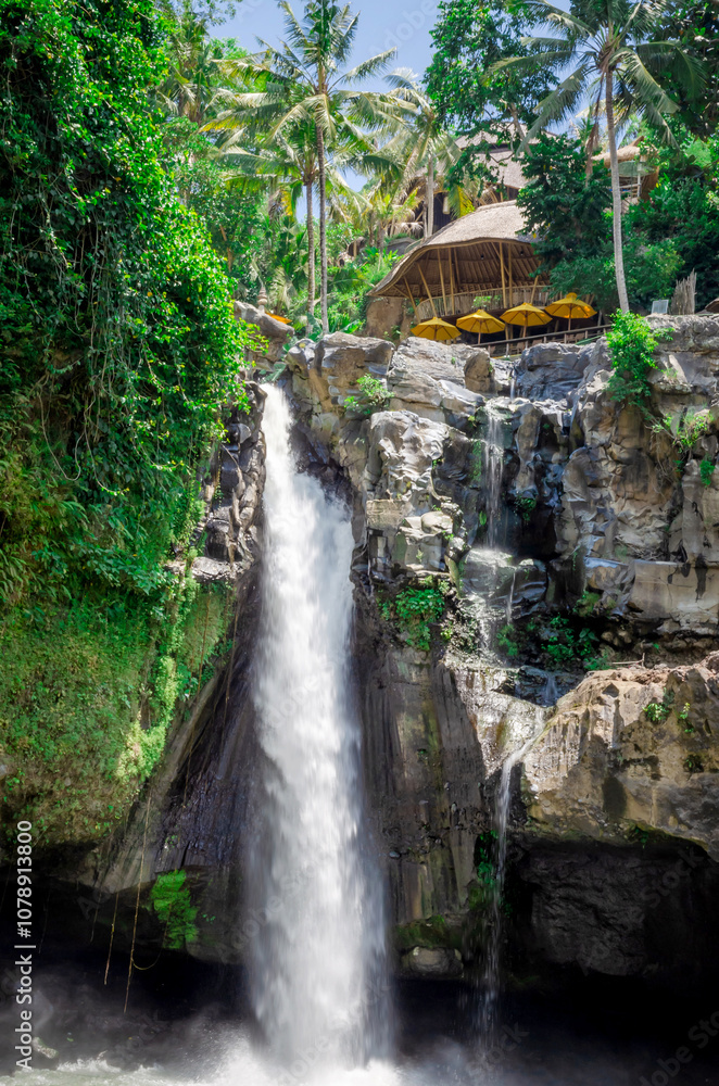 Beautiful Tegenungan waterfall in tropical rainforest in Bali, Indonesia