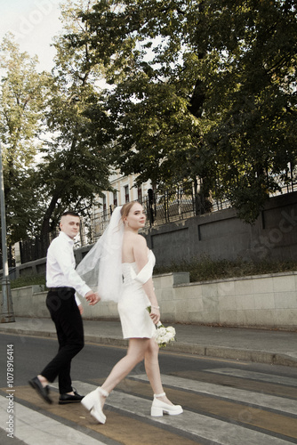 Newlyweds guy and girl. Wedding. White dress. Happiness.