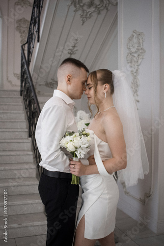 Newlyweds guy and girl. Wedding. White dress. Happiness.