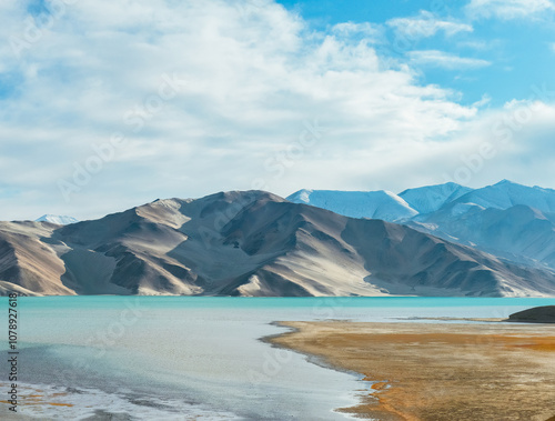 The autumn scenery of the Baisha Lake and Baisha Mountain and wetland landscape along National Highway G314 on the Pamir Plateau in Xinjiang, China during October photo