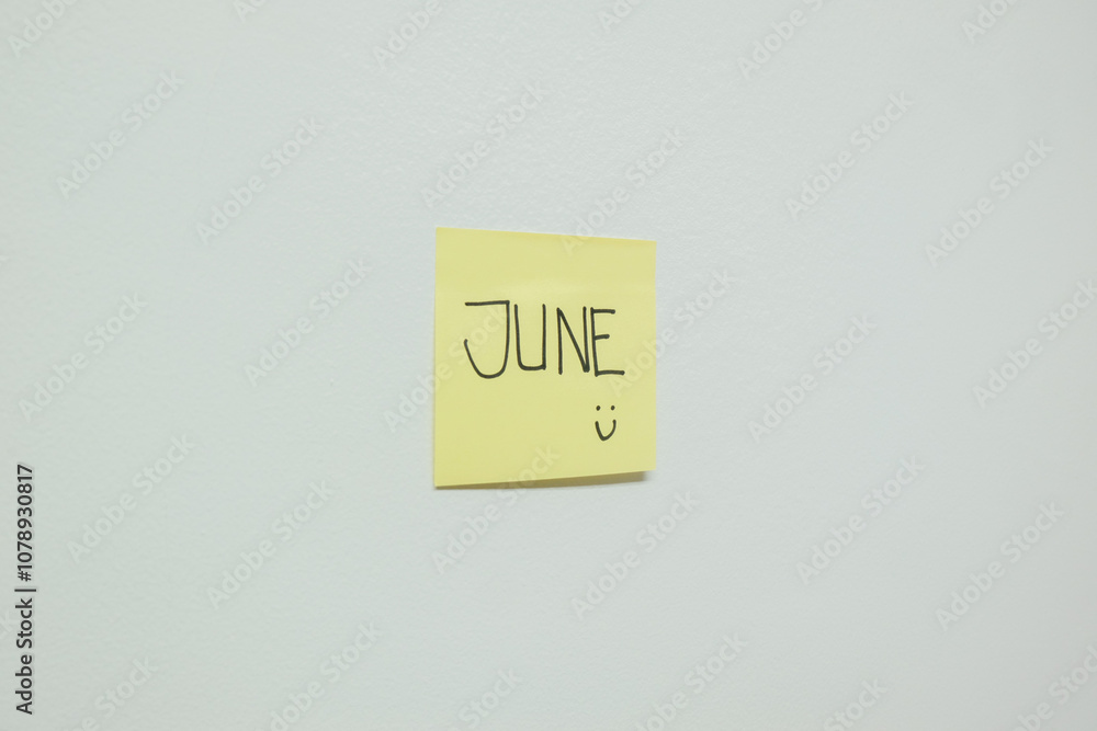 June sign on a sticky note. June sign on a sticky note.
