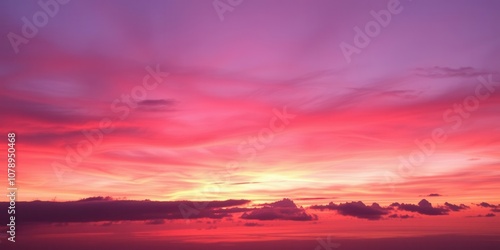 Vibrant orange and pink hues mixing into a purple sky at sunset, pink, peaceful, dusk