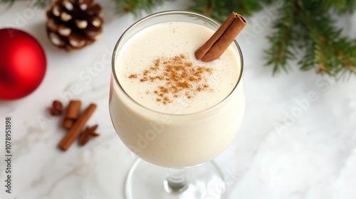 A glass of eggnog with cinnamon and nutmeg, perfect for a festive holiday gathering