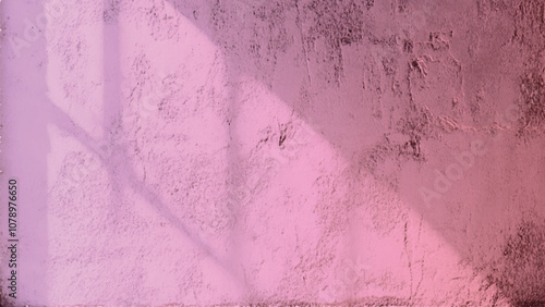 Textured pink wall background with subtle details and imperfections. pink wall texture. Textured pink wall with a rough surface illuminated softly, simple and abstract.