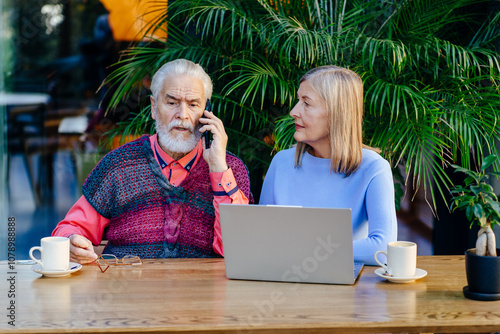 Senior Business People Analyze Business in Cafe photo