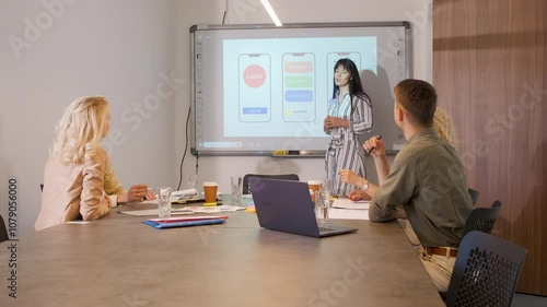 Group of business people working while sitting in a meeting room.