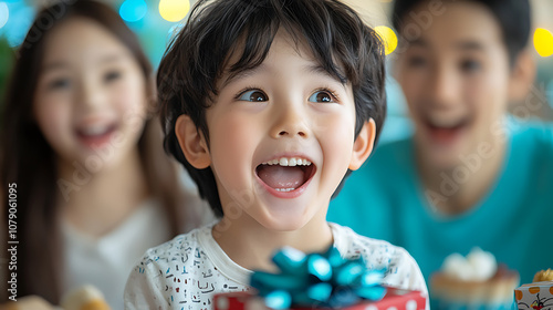 Parents joyfully watch their children unwrap new year's presents with excitement and laughter photo