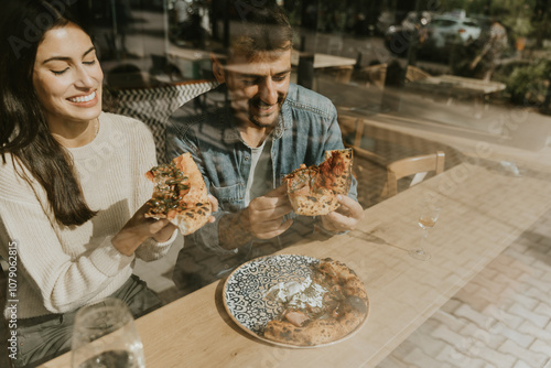 Enjoying delicious pizza to...