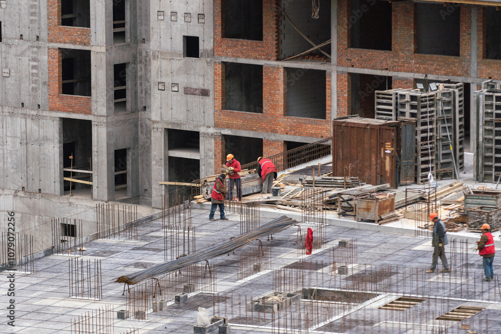 Construction workers working on Construction machine. Aerial platform for workers who work at height on buildings. Construction workers working on Construction machine. Aerial platform for workers who work at height on buildings.