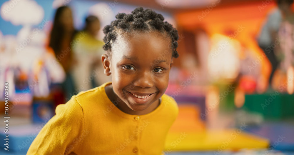 Close Up Portrait of an Adorable Little Black Girl with Brown Eyes Looking at Camera, Smiling Happily and Waving with Her Hand. Smart Talented Girl Laughing and Having Fun in Daycare Close Up Portrait of an Adorable Little Black Girl with Brown Eyes Looking at Camera, Smiling Happily and Waving with Her Hand. Smart Talented Girl Laughing and Having Fun in Daycare