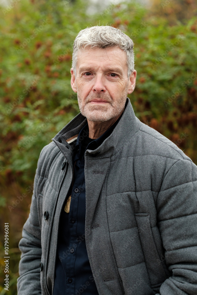 Portrait of confident senior man enjoying nature outdoors Portrait of confident senior man enjoying nature outdoors