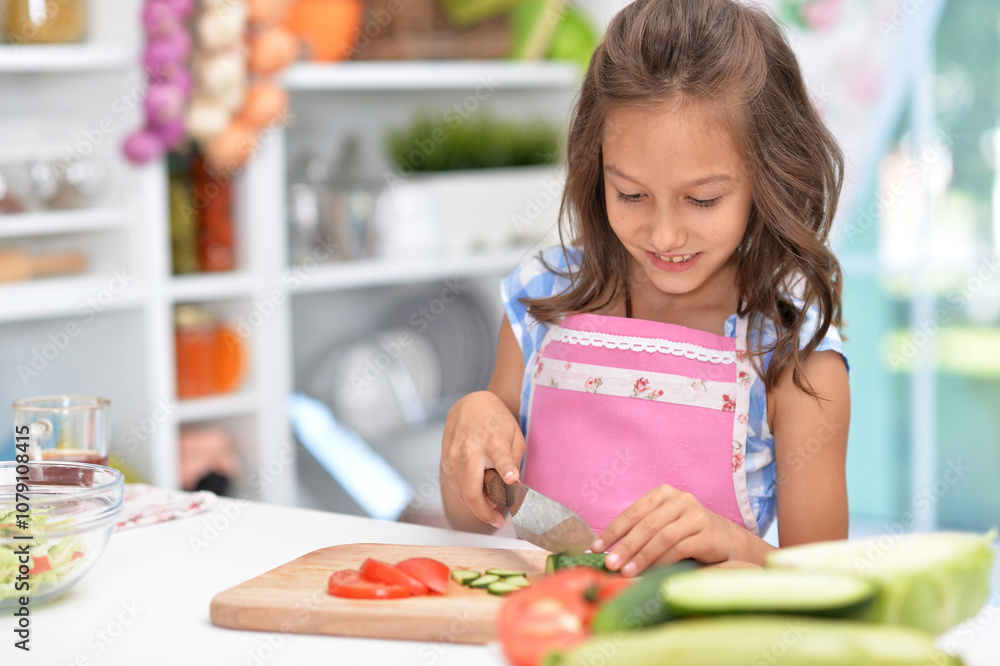 Cute happy girl coocking salad on kitchen Cute happy girl coocking salad on kitchen