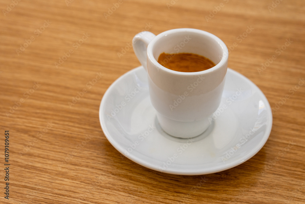 Espresso cup on a café terrace table, capturing the warmth of a quiet morning. Rich crema topping the coffee adds texture, while soft shadows evoke a relaxed outdoor ambiance. Espresso cup on a café terrace table, capturing the warmth of a quiet morning. Rich crema topping the coffee adds texture, while soft shadows evoke a relaxed outdoor ambiance.