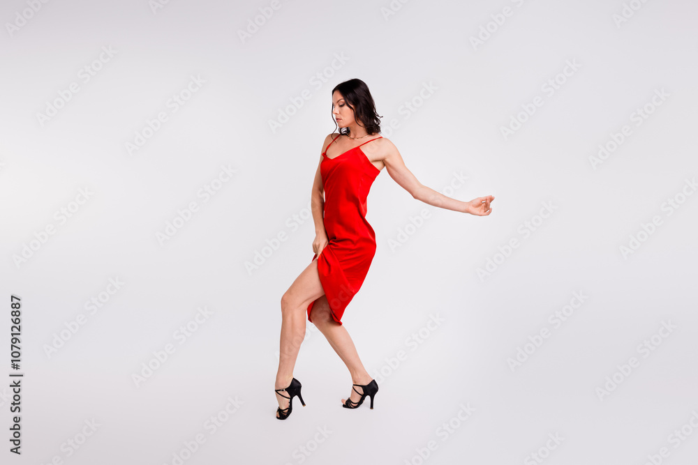 Full length photo of gorgeous charming lady wear seductive red dress enjoy bachata dance copy space isolated white color background Full length photo of gorgeous charming lady wear seductive red dress enjoy bachata dance copy space isolated white color background