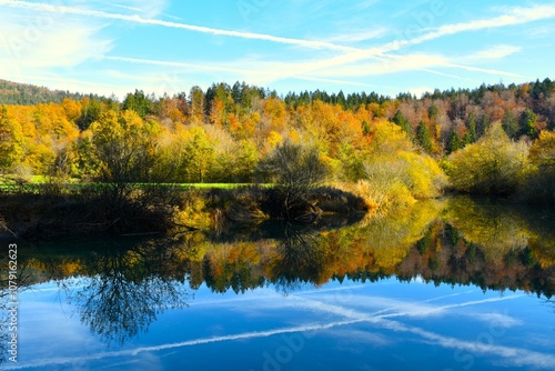 Wallpaper Mural View of Jezerščica river at Cerkniško jezero lake with an autumn orange and yellow colored forest above in Notranjska, Slovenia Torontodigital.ca