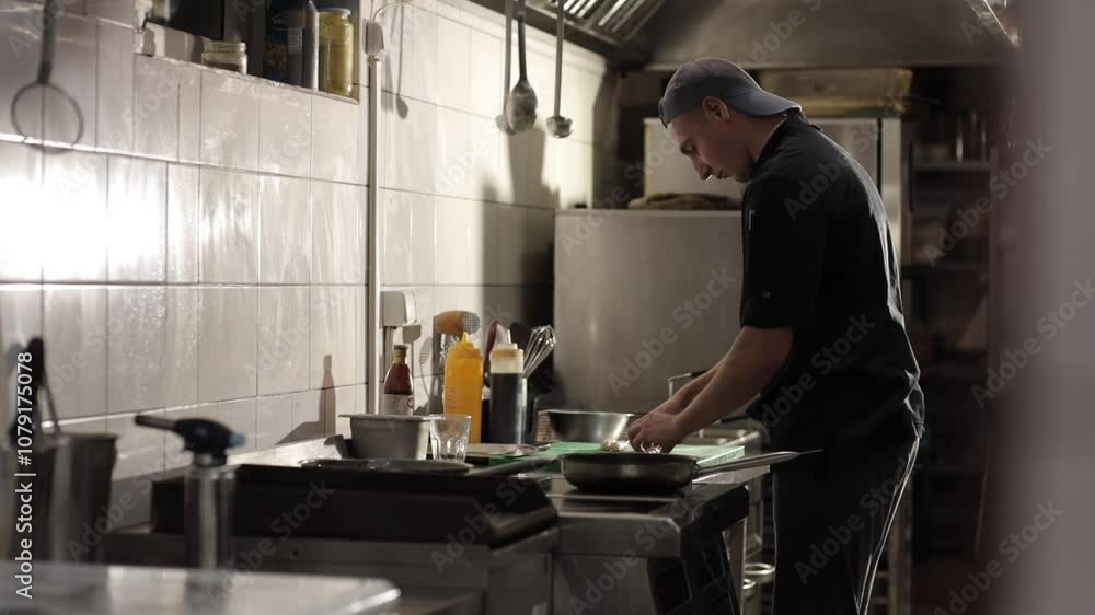 Chef is cooking in the kitchen Chef is cooking in the kitchen