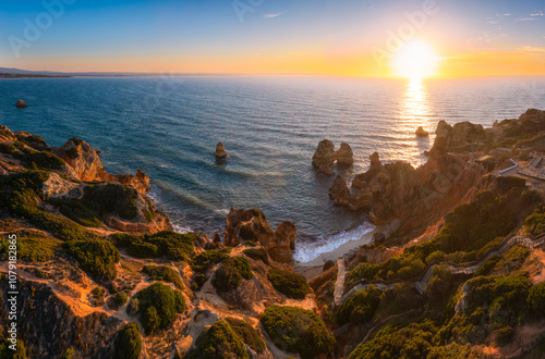 Aerial view of rock formation at Camilo beach in Algarve, Portugal during sunrise  photo