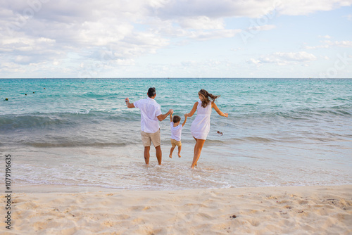 Happy family on the tropical beach. Family vacation