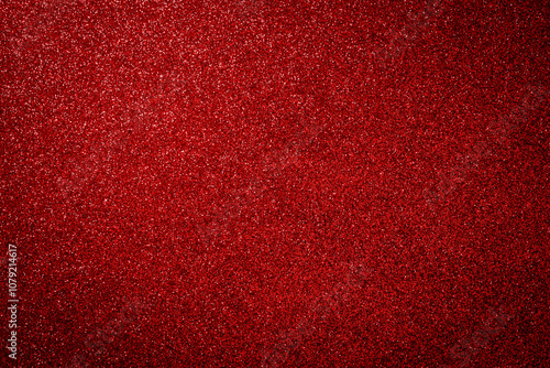 Metallic glitter grainy red background.