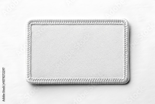 Blank rectangular fabric patch mockup with stitched border on white background, perfect for branding design.